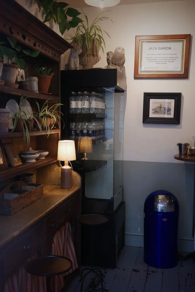 Seating corner with framed prints and the dresser