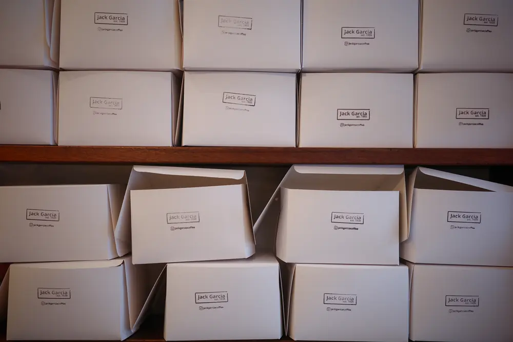 Stacked Jack Garcia pastry boxes