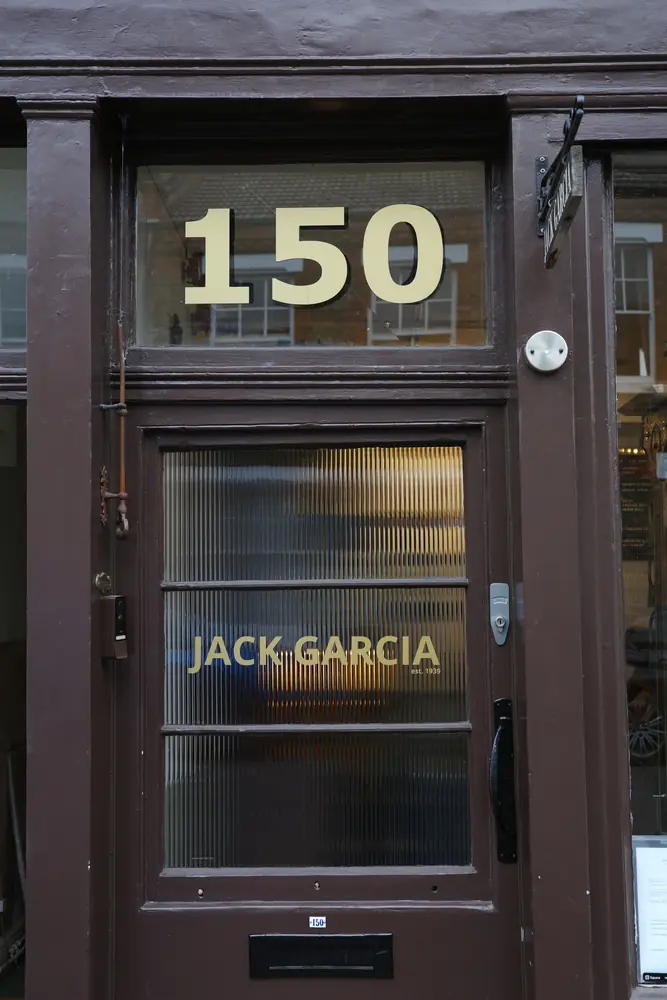 Front door with gold Jack Garcia lettering and the 150 number